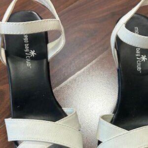 White shoe with black wedge